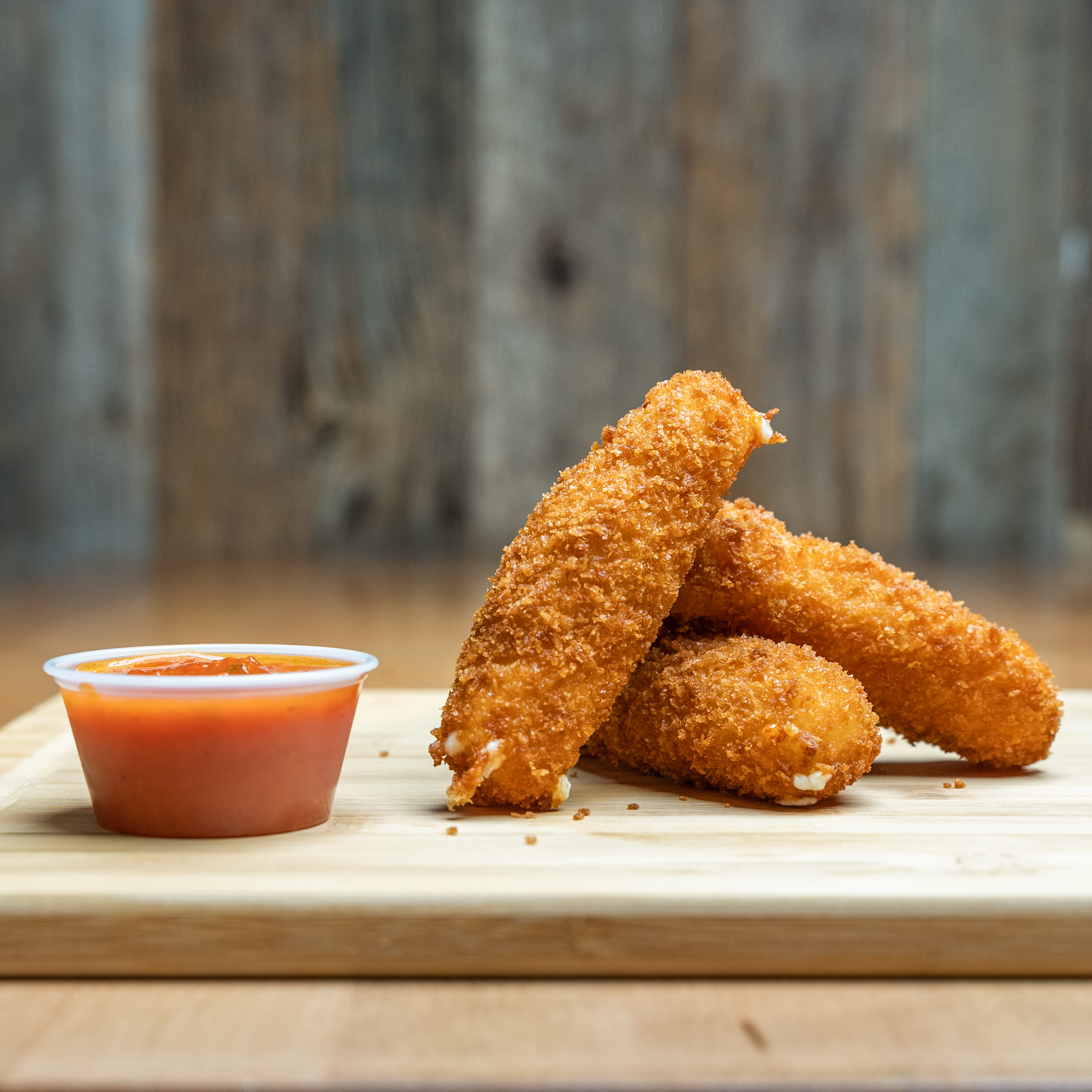 Mozza Bricks - 3 golden-fried mozzarella bricks with a kick of sp...